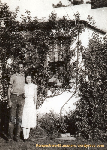 My father and mother in front of the house he built for them before their marriage. 